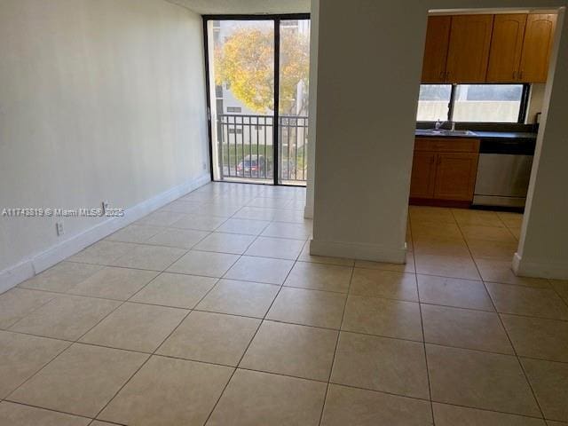 tiled spare room with a wealth of natural light and floor to ceiling windows