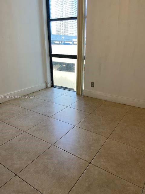 view of tiled spare room