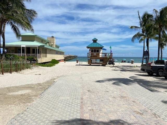 view of street with a water view and a view of the beach