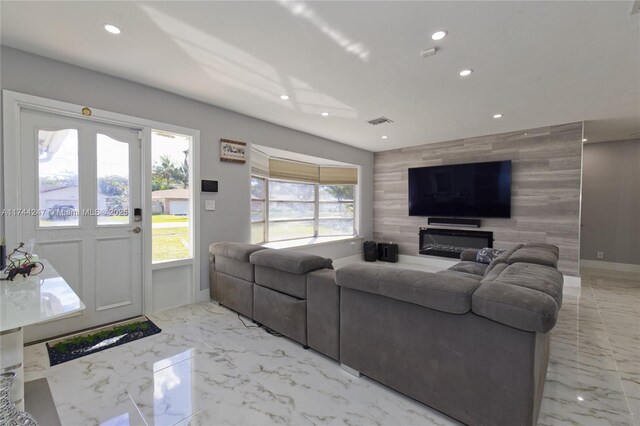 161 NW 46th Ter, Plantation, FL 33317 - living room featuring recessed lighting, marble finish floor, an accent wall, and visible vents