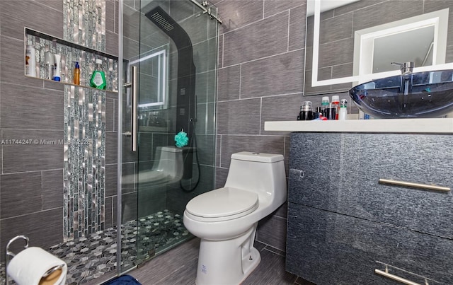 161 NW 46th Ter, Plantation, FL 33317 - bathroom with vanity, a shower stall, toilet, and tile walls