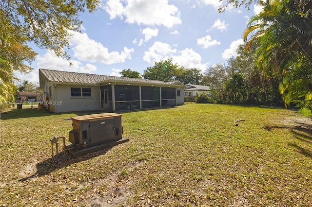 161 NW 46th Ter, Plantation, FL 33317 - rear view of property with stucco siding, a lawn, a tile roof, and a sunroom