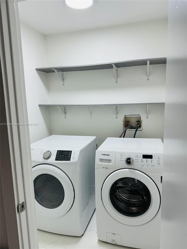 laundry room featuring washing machine and dryer