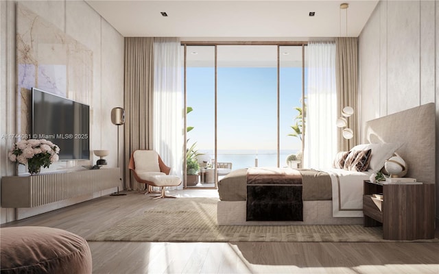 bedroom with a water view and light hardwood / wood-style flooring