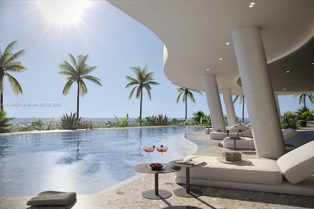 view of swimming pool featuring a patio area