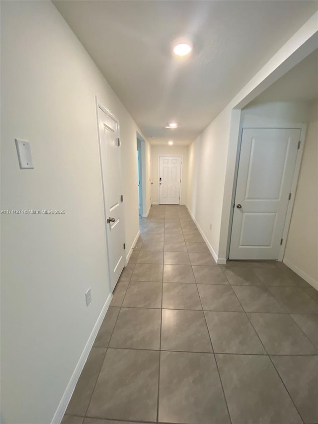 corridor with tile patterned flooring