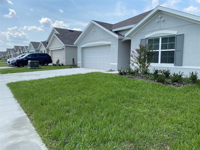 single story home with a garage and a front yard