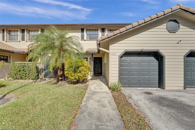 9007 Vineyard Lake Dr Unit 9007, Plantation, FL 33324 - view of front of home with a garage and a front yard