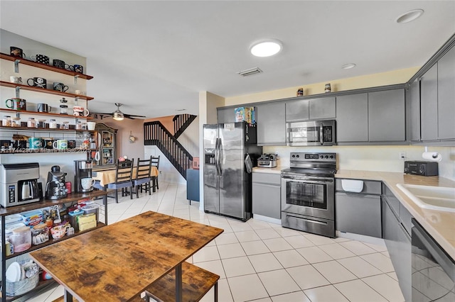 9007 Vineyard Lake Dr Unit 9007, Plantation, FL 33324 - kitchen with stainless steel appliances, gray cabinetry, ceiling fan, and light tile patterned floors