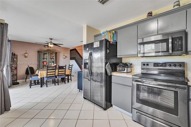 9007 Vineyard Lake Dr Unit 9007, Plantation, FL 33324 - kitchen with ceiling fan, appliances with stainless steel finishes, gray cabinetry, tasteful backsplash, and light tile patterned flooring