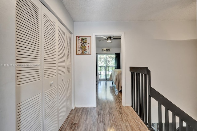 9007 Vineyard Lake Dr Unit 9007, Plantation, FL 33324 - hall featuring light hardwood / wood-style floors and a textured ceiling