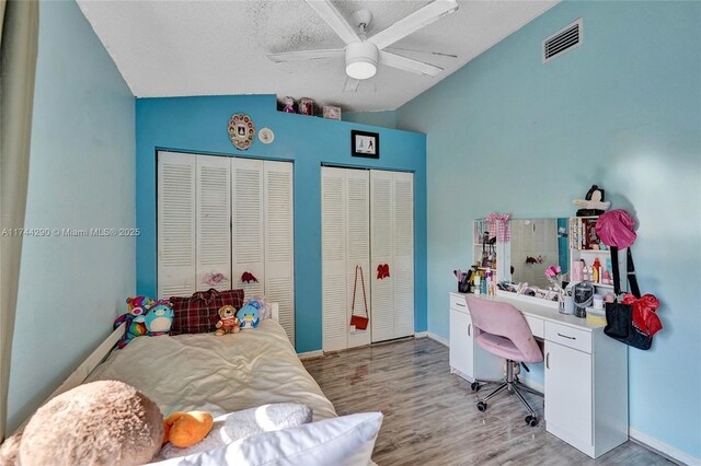 9007 Vineyard Lake Dr Unit 9007, Plantation, FL 33324 - home office with vaulted ceiling, light hardwood / wood-style flooring, and a textured ceiling