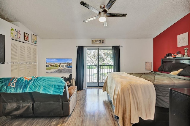 9007 Vineyard Lake Dr Unit 9007, Plantation, FL 33324 - bedroom with access to exterior, light hardwood / wood-style flooring, a textured ceiling, and ceiling fan