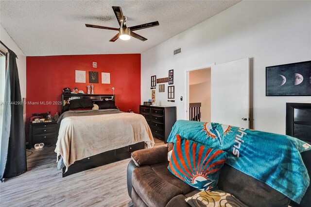 9007 Vineyard Lake Dr Unit 9007, Plantation, FL 33324 - bedroom with hardwood / wood-style flooring, ceiling fan, lofted ceiling, and a textured ceiling