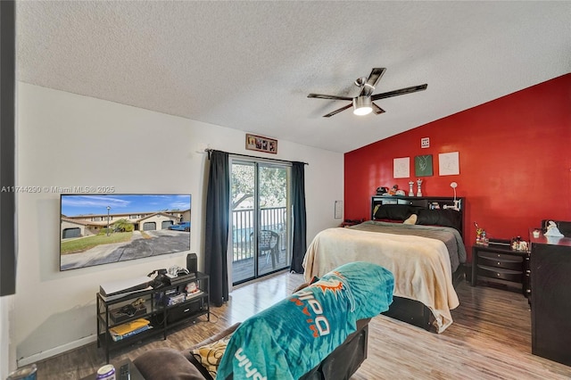 9007 Vineyard Lake Dr Unit 9007, Plantation, FL 33324 - bedroom with vaulted ceiling, hardwood / wood-style floors, access to outside, ceiling fan, and a textured ceiling