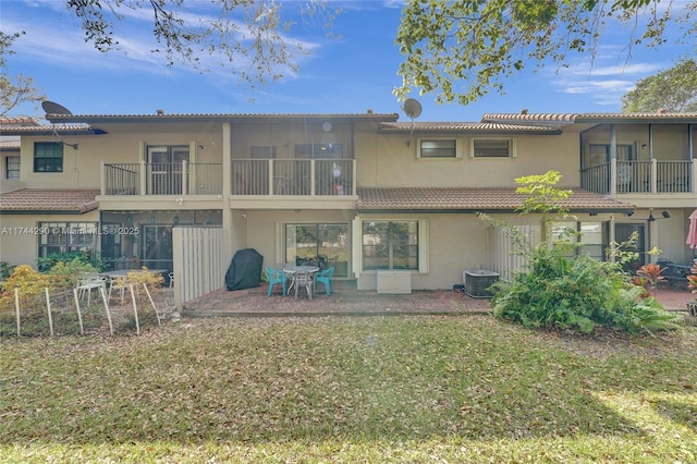 9007 Vineyard Lake Dr Unit 9007, Plantation, FL 33324 - rear view of house with a balcony, a yard, central air condition unit, and a patio area