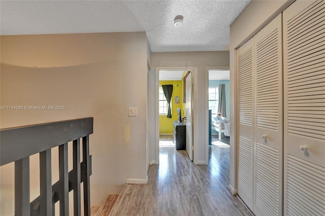 9007 Vineyard Lake Dr Unit 9007, Plantation, FL 33324 - hall with a textured ceiling and light hardwood / wood-style flooring