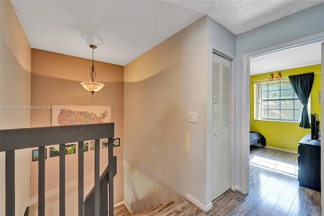 9007 Vineyard Lake Dr Unit 9007, Plantation, FL 33324 - hallway with hardwood / wood-style flooring and a textured ceiling