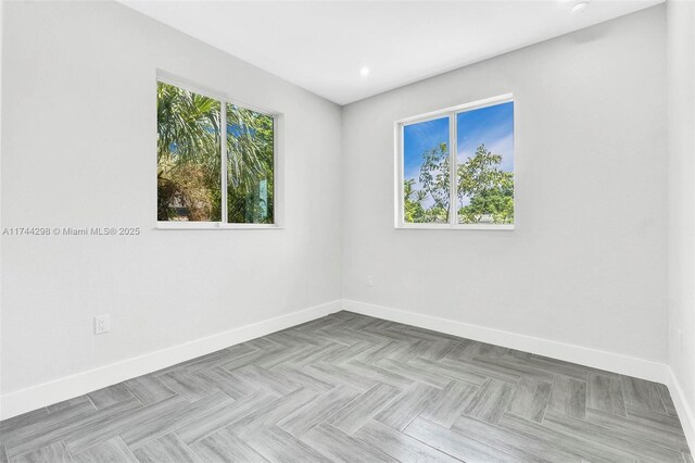 unfurnished bedroom with a closet and light parquet floors