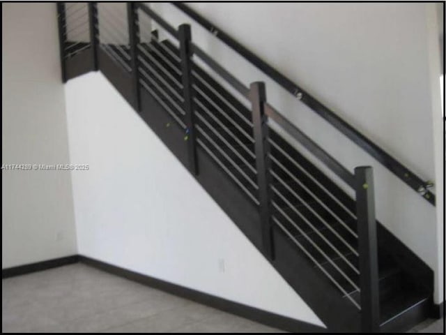 stairway with baseboards