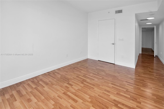 unfurnished room with light hardwood / wood-style flooring