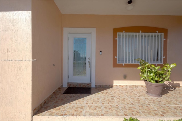 property entrance with a patio