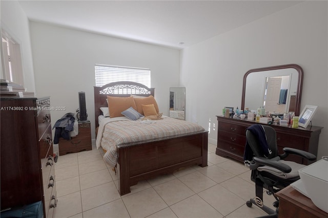 bedroom featuring light tile patterned floors