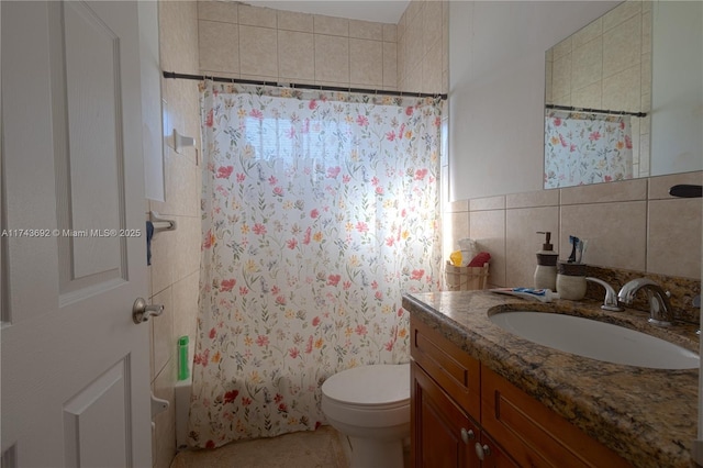 full bathroom featuring vanity, tile walls, shower / bath combination with curtain, and toilet