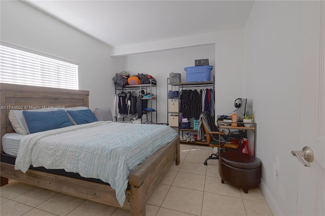 bedroom with light tile patterned flooring