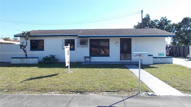 ranch-style house with a front lawn