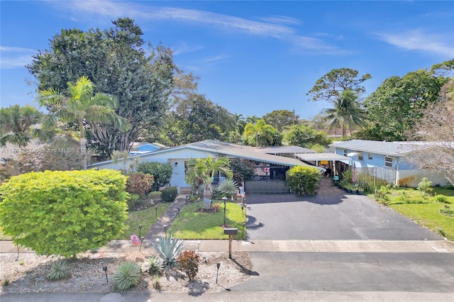 view of front facade with a carport