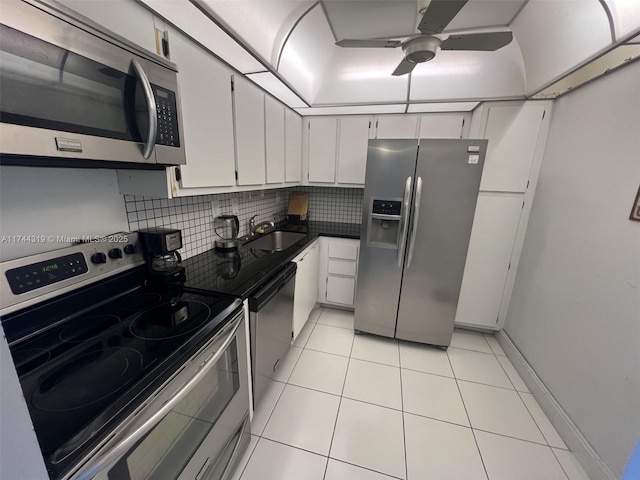 kitchen featuring white cabinetry, appliances with stainless steel finishes, sink, and backsplash