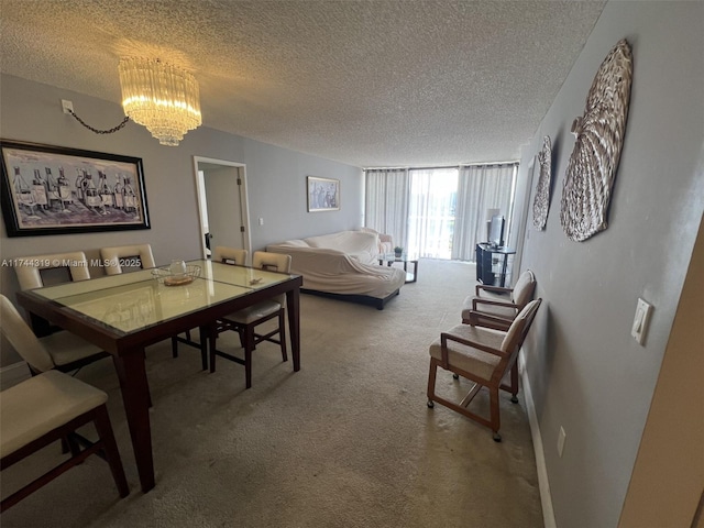 dining area featuring carpet flooring, a chandelier, and a textured ceiling