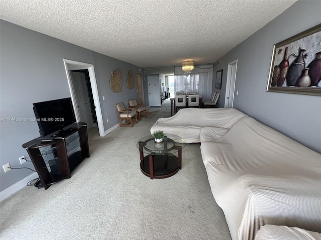 living room with carpet and a textured ceiling