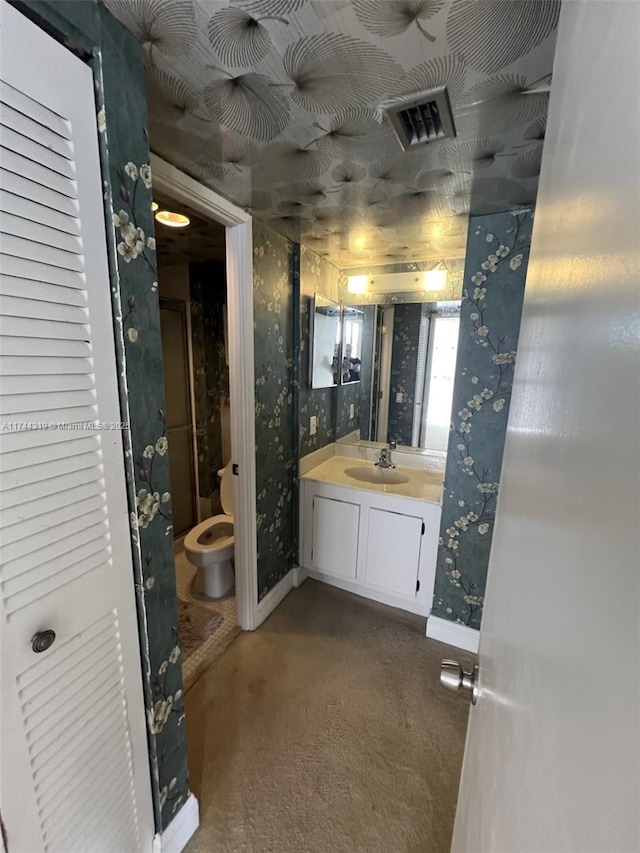 bathroom with vanity and toilet