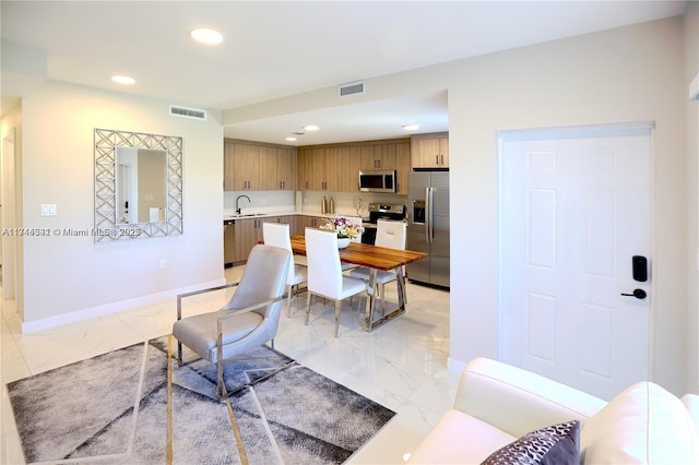 dining area featuring sink