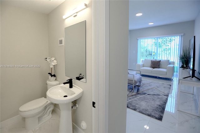 bathroom featuring toilet