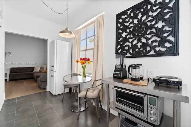 1005 Meridian Ave Unit 7, Miami Beach, FL 33139 - dining space featuring dark tile patterned floors