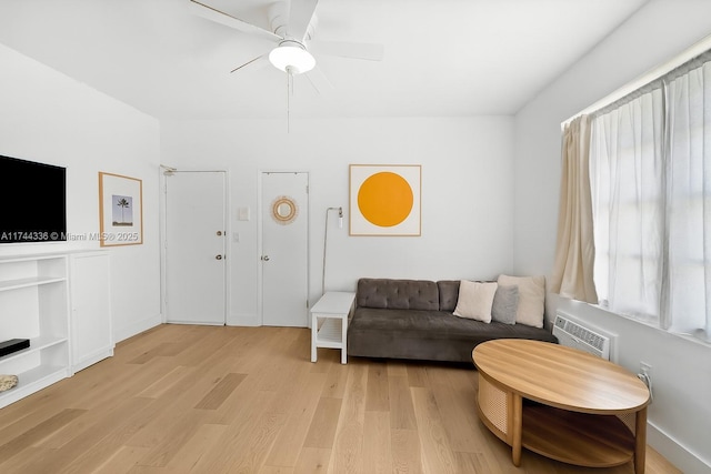 1005 Meridian Ave Unit 7, Miami Beach, FL 33139 - living area featuring light wood finished floors, a ceiling fan, and a wall unit AC