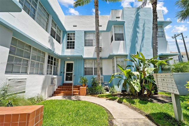 1005 Meridian Ave Unit 7, Miami Beach, FL 33139 - view of front of property featuring stucco siding and entry steps