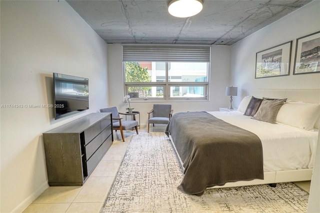 bedroom with light tile patterned floors