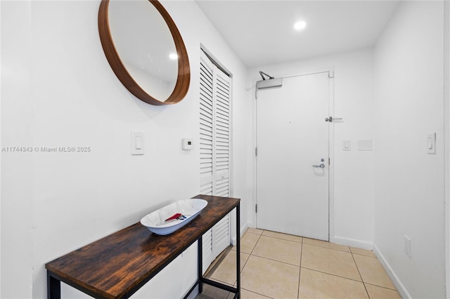 doorway to outside featuring light tile patterned floors