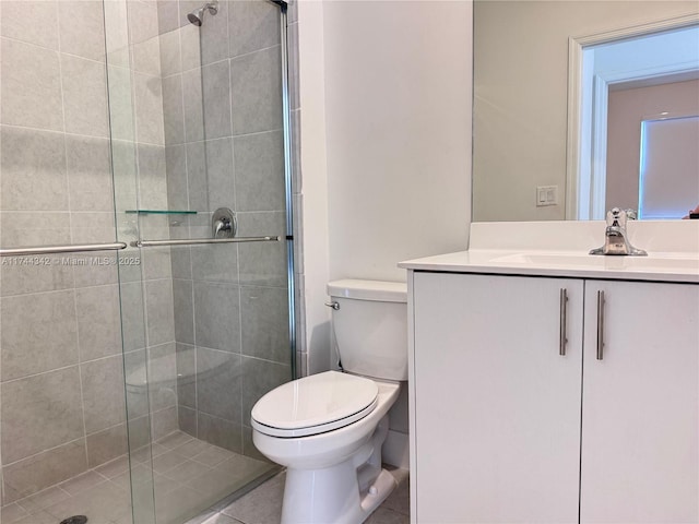 bathroom with vanity, an enclosed shower, and toilet