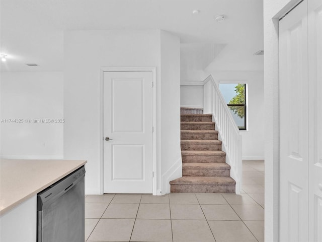 staircase with tile patterned flooring