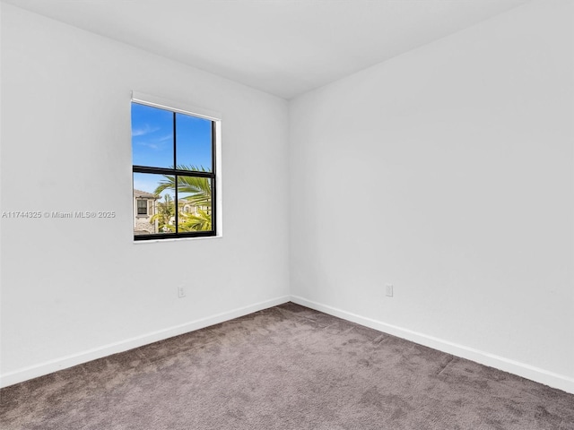 unfurnished room featuring carpet flooring