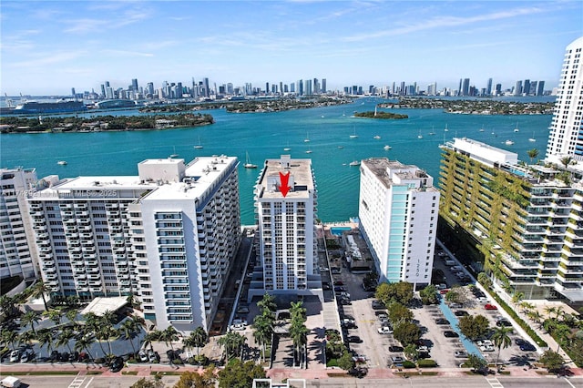 aerial view with a city view and a water view