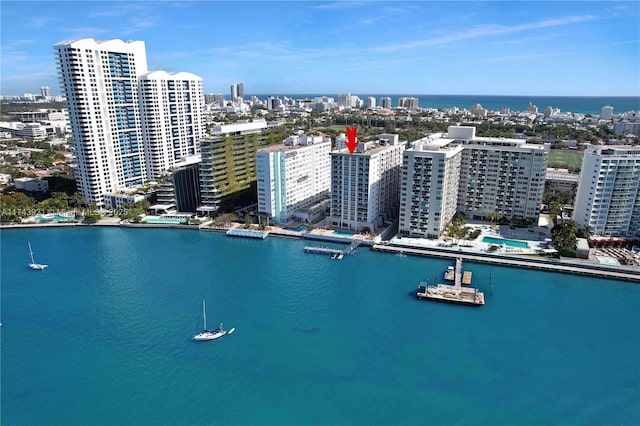 drone / aerial view featuring a water view and a city view