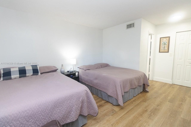 bedroom with light hardwood / wood-style floors