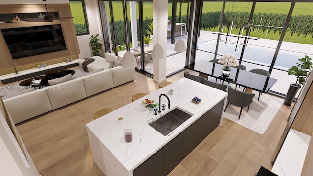 living area with light wood-type flooring and ceiling fan