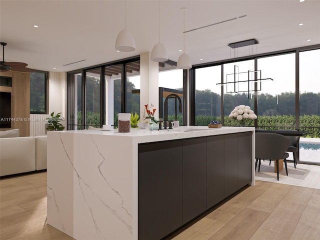 reception featuring ceiling fan and a sink